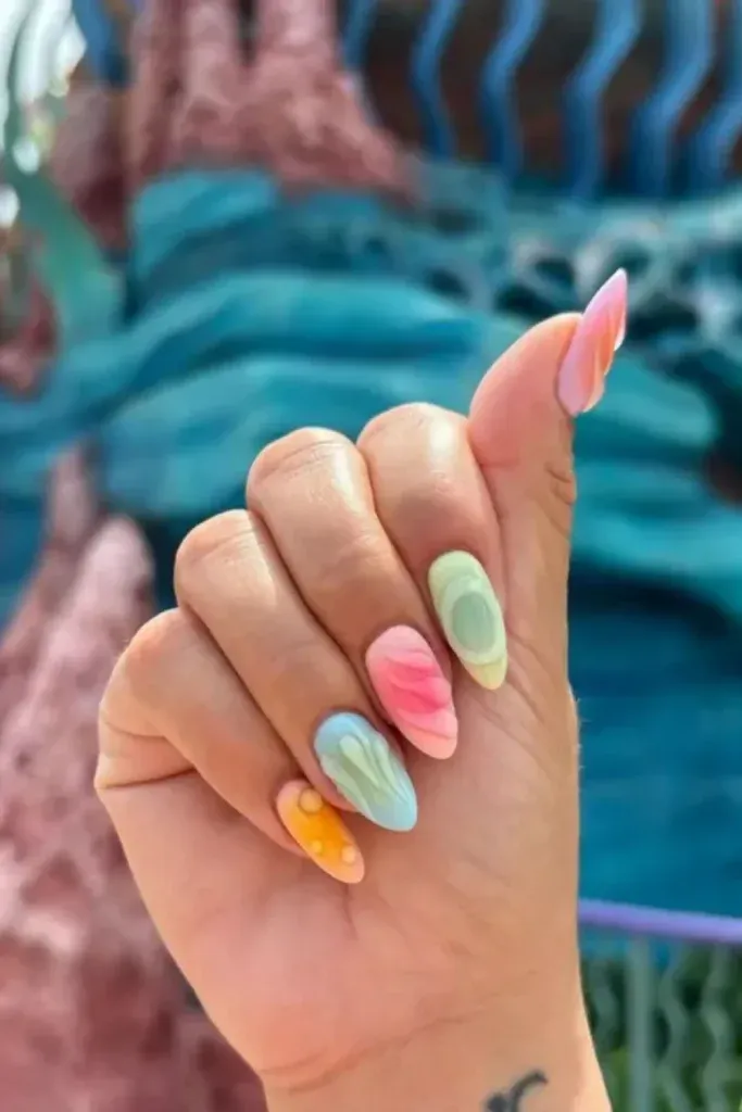 Sculpted 3D Nail Art - Pastel almond nails with raised swirls in pink, mint, and baby blue