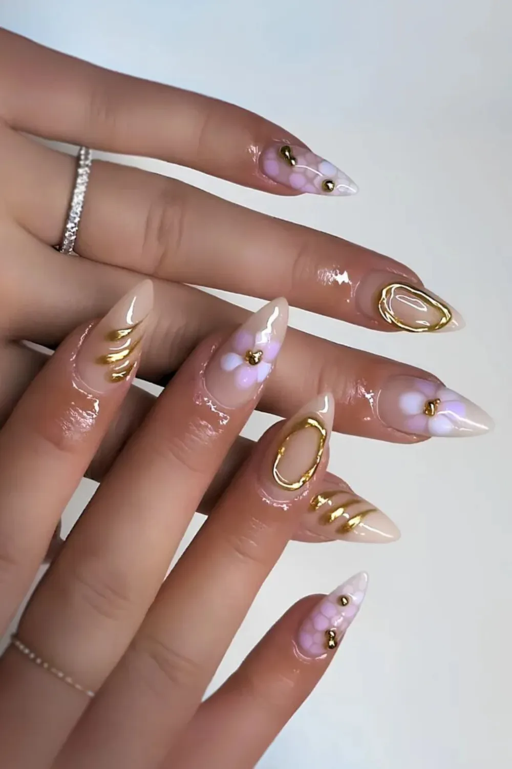 Gold Metallic Accent Nails – Minimal base with bold gold foil details.
<p>Soft Pink Aura Nails – Gradient pink tones for a halo effect." class="wp-image-5443"></figure></p>
<!-- /wp:image -->
<!-- wp:paragraph -->
<p><em>@<a href=