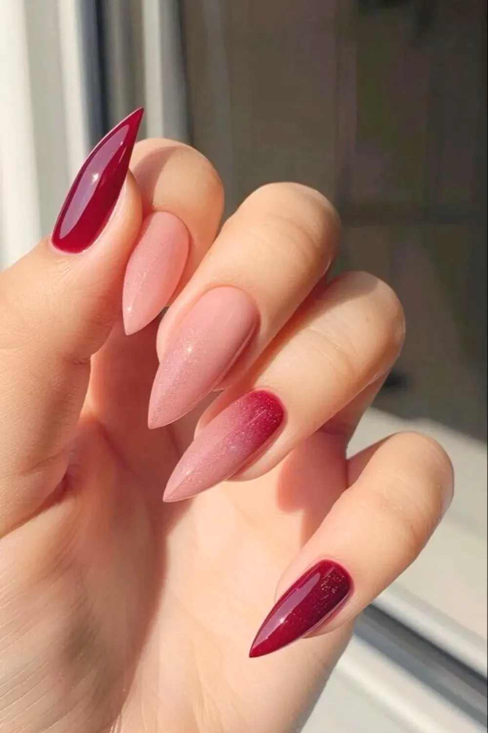 Elegant ombré nails transitioning from burgundy to nude for a sophisticated and trendy look