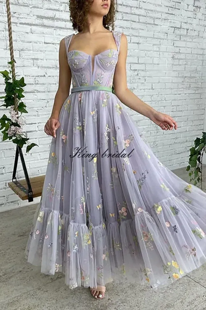 Lavender Embroidered Floral Gown - Woman in a lavender tulle gown with floral embroidery and corset bodice.