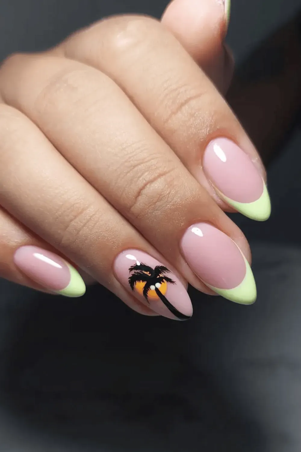 Fun neon French tips with a palm tree design on the ring finger, offering a tropical and playful design