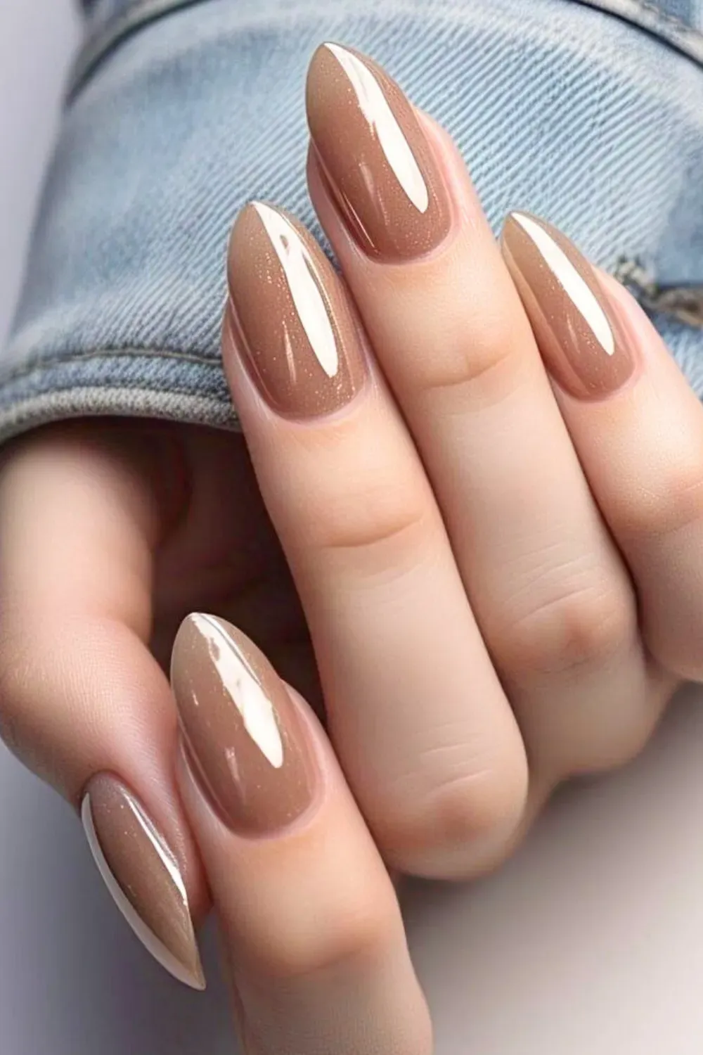 Sleek nude stiletto nails with a glossy finish, perfect for a minimalist and elegant appearance