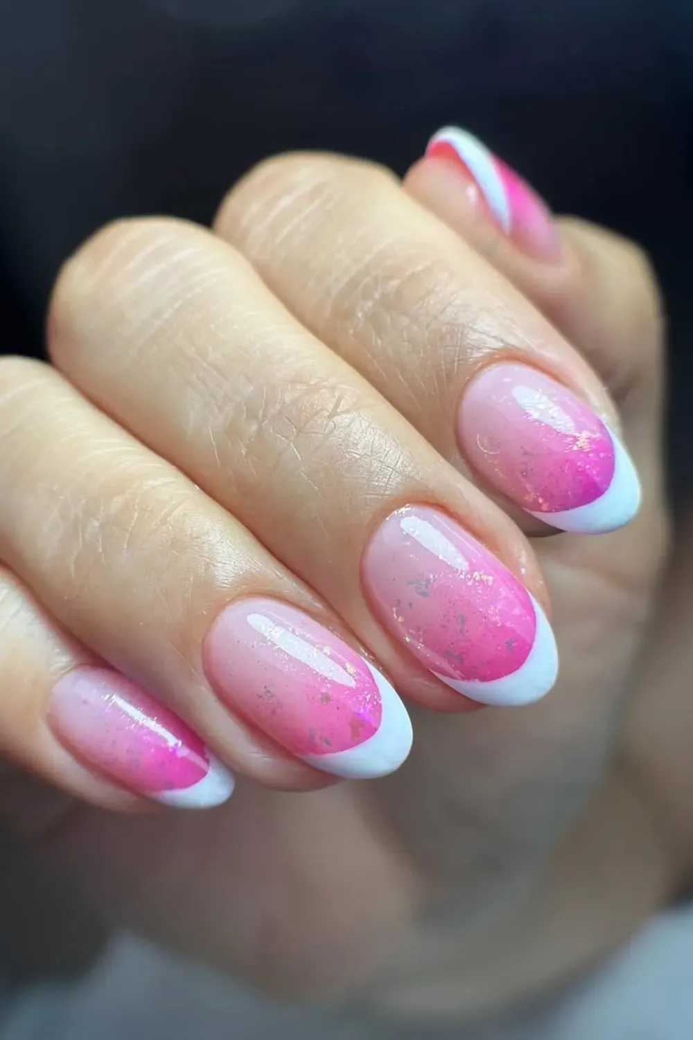  Soft pink to white ombre French tips with a touch of sparkle.