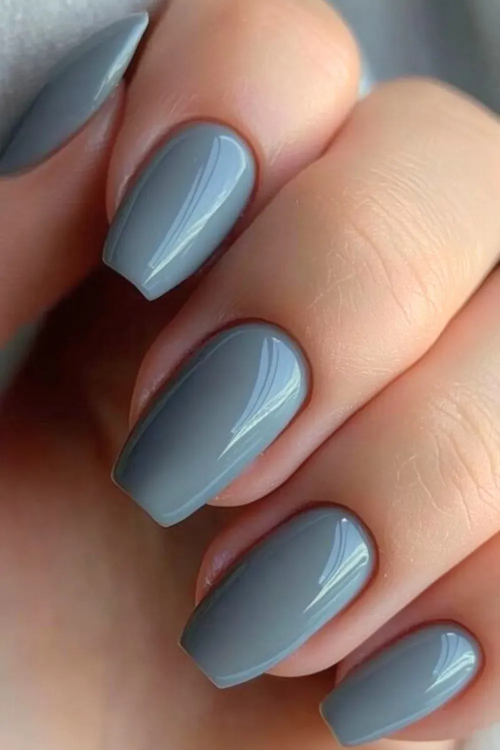 Smokey grey nails in a sleek square shape, offering a modern and chic appearance with a glossy finish.
