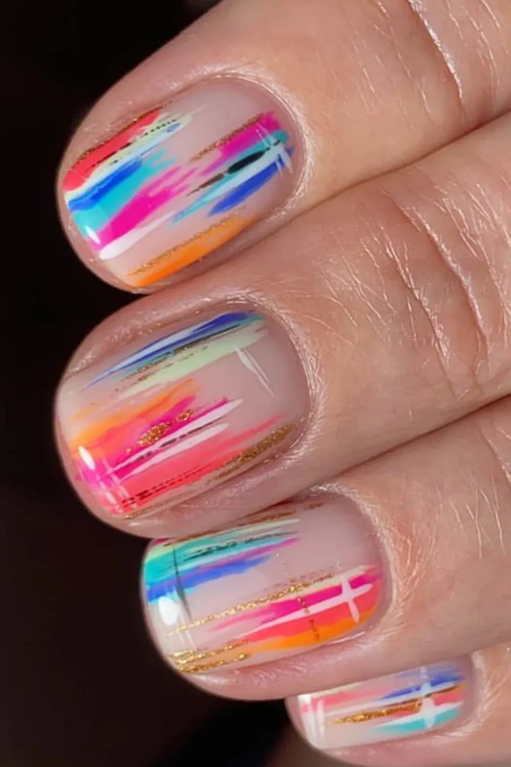 Abstract Spring Nails – Geometric designs with bold colors.