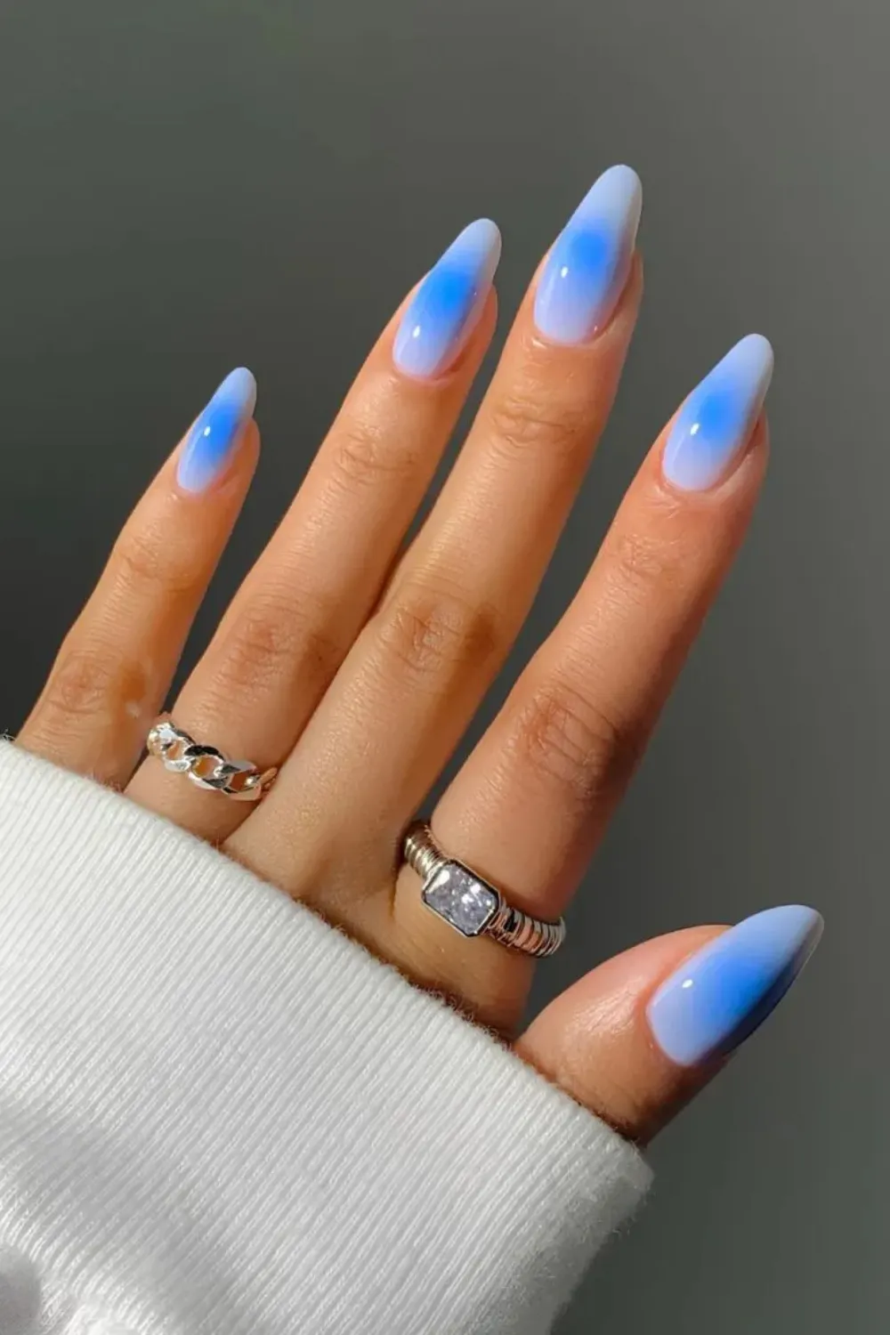 Baby Blue Ombre Nails - Gradient sky blue and white ombre nails for a dreamy look.