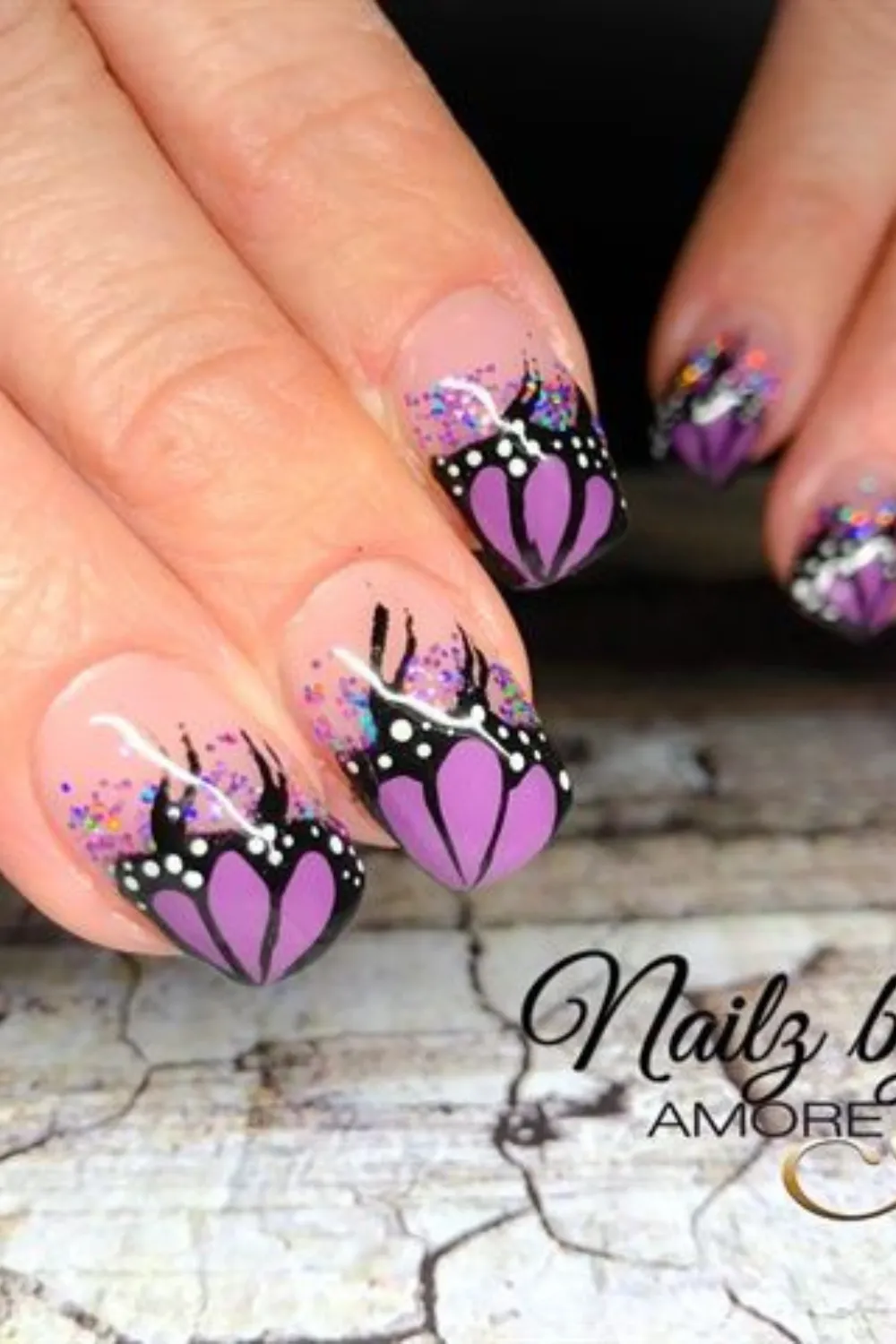 Butterfly and Floral Fusion Nails - Pastel nails featuring butterflies and floral patterns, creating a nature-inspired look.