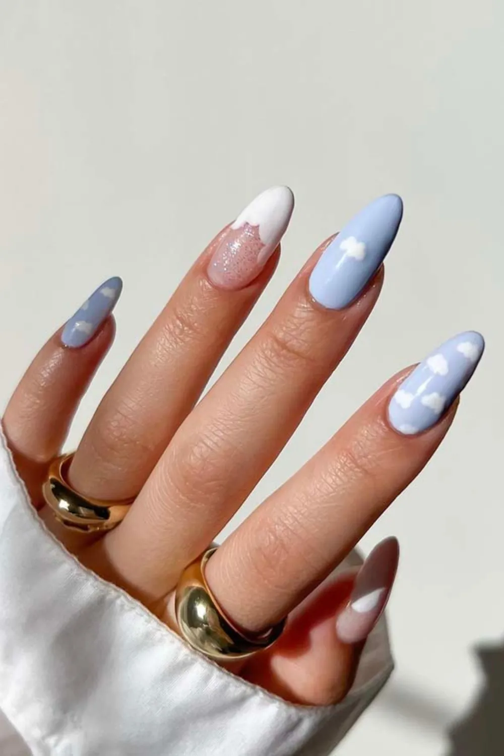 Cloudy Sky Blue Nails - Sky blue nails with hand-painted white clouds.