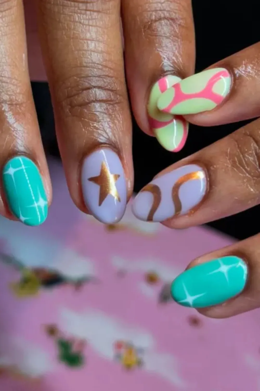 Colorful Retro Spring Nail Art - Retro-inspired colorful abstract spring nails with stars and swirls