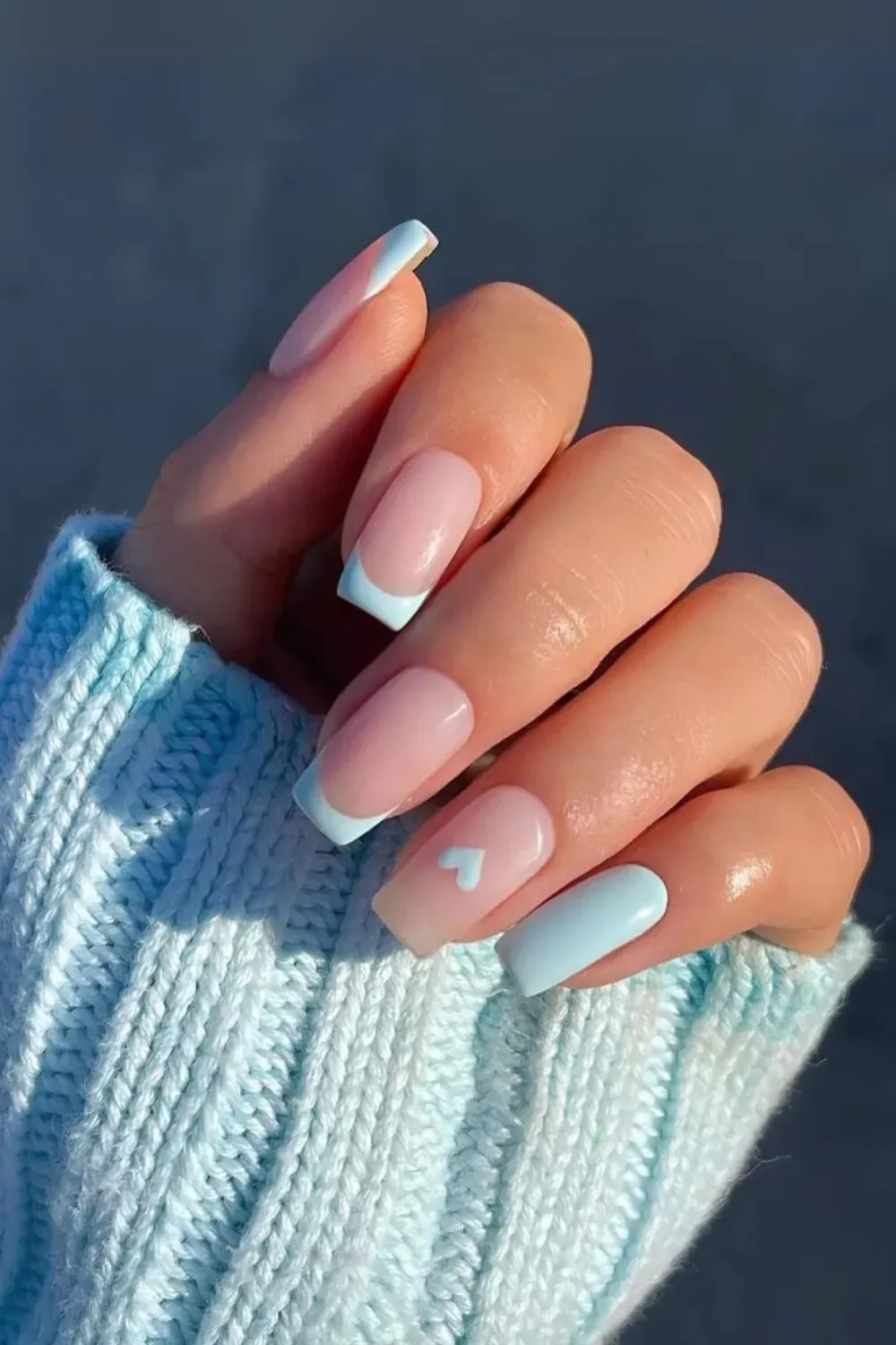 Sky Blue Heart Nails - Cute sky blue nails with small heart patterns.
