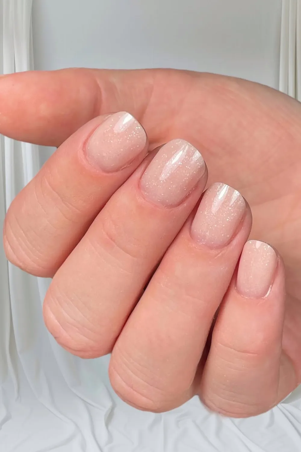 Ethereal Nude Nails - Light nude nails with subtle shimmer, ideal for a minimal spring look.