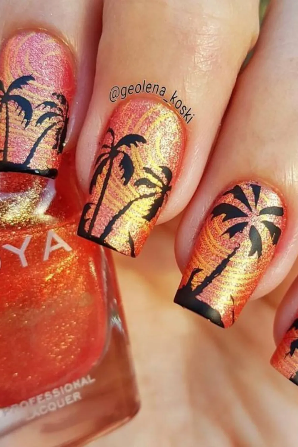 Floral Sunset Bliss Nails - Coral and pink sunset-inspired nails with tiny white flower accents.