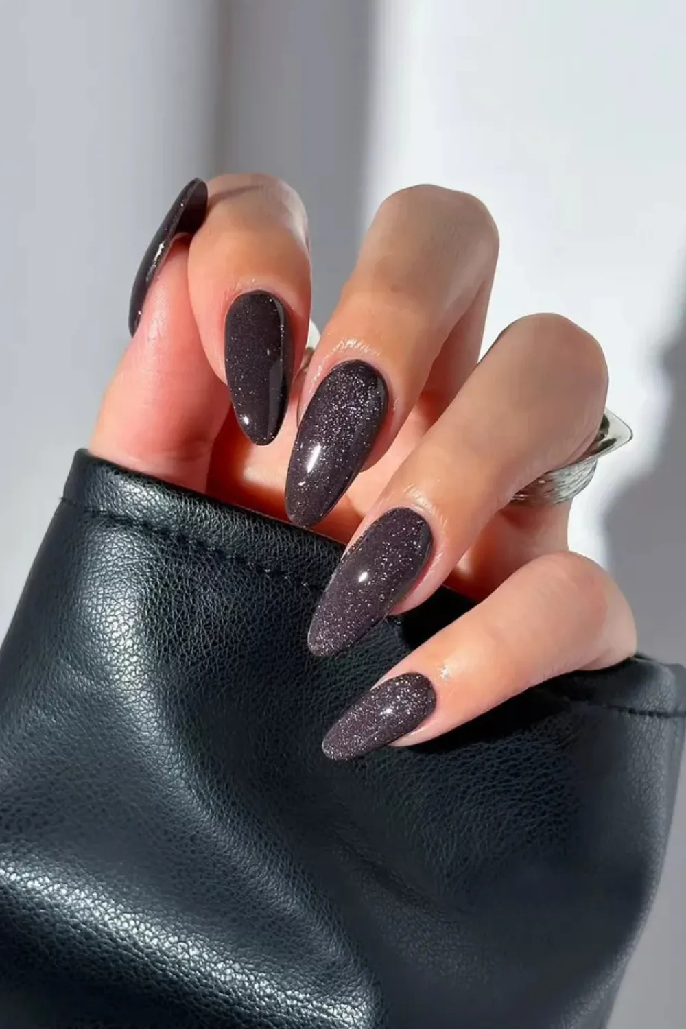 Glossy Black Cat Eye Nails - Shiny black cat eye nails with a bold magnetic effect, perfect for a dramatic spring manicure