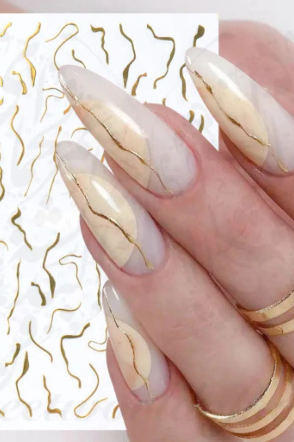 Gold Stripe Nail Design - Glamorous Minimalist Accent : Gold stripe nails showcasing modern and elegant designs.
