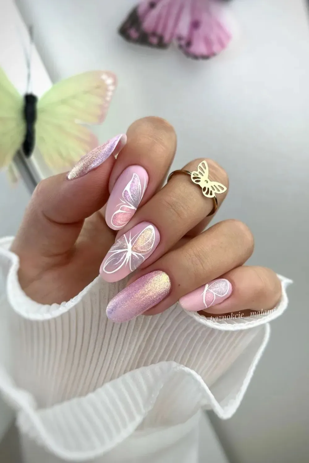 Holographic Butterfly Magic Nails - Holographic butterfly decals on a light pink base, creating a sparkling effect.