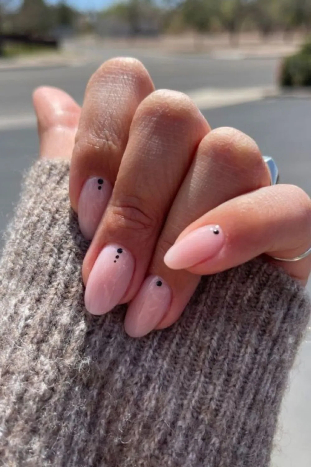 Minimalist Almond Nails 2025 - Almond shaped nails painted in minimalist nude tones 2025