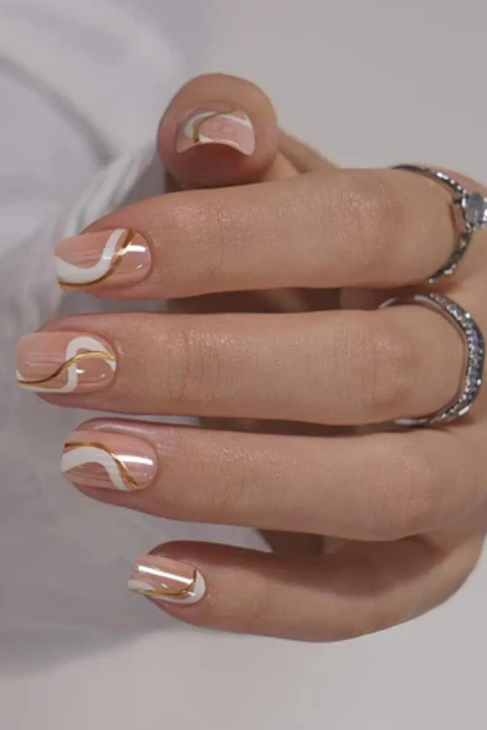 Minimalist Chic Nails – Sleek lines and dots for a modern touch