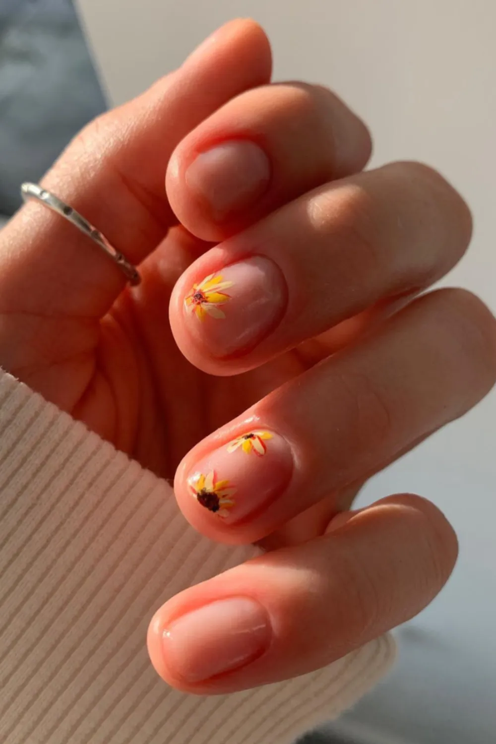 Minimalist Floral Line Nails – Thin floral outlines on a clear base.
