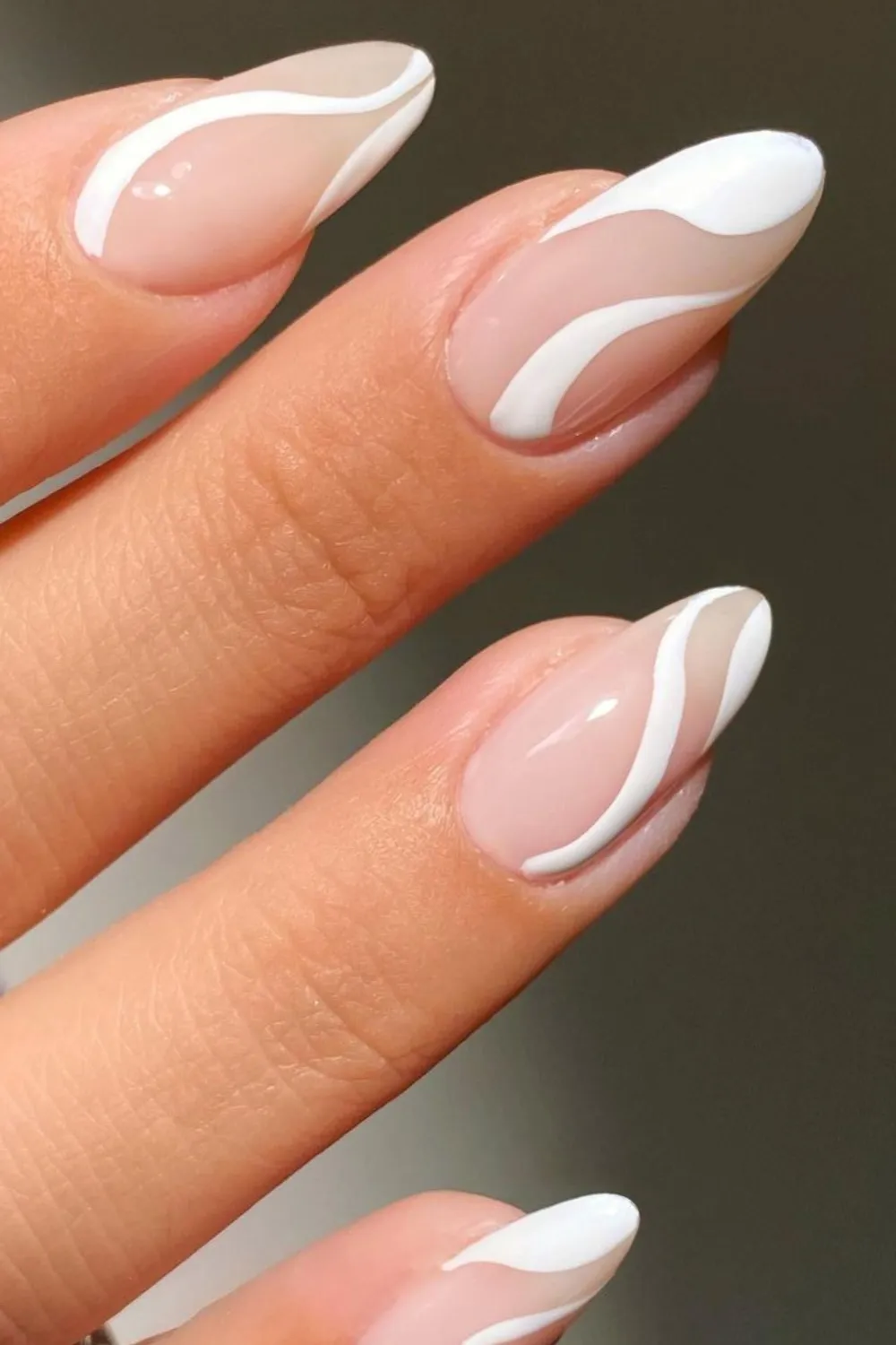 Minimal white line art on nude nails
Nude nails with simple minimalist white designs