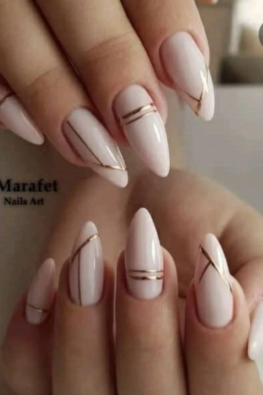 Gold Stripe Nail Design - Glamorous Minimalist Accent : Gold stripe nails showcasing modern and elegant designs.