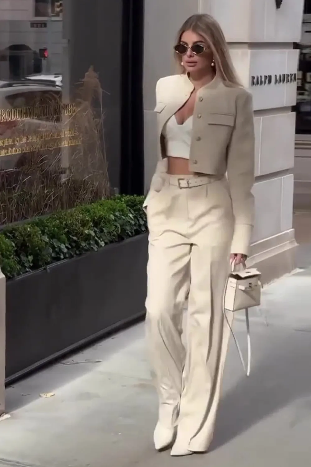 Neutral Power Suit 2025 - Woman in a beige cropped blazer and wide-leg trousers set