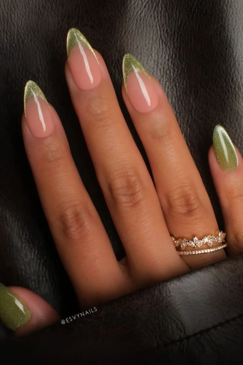 Olive Glitter French Nails -Almond-shaped nails with sheer pink base and olive green glittery French tips.