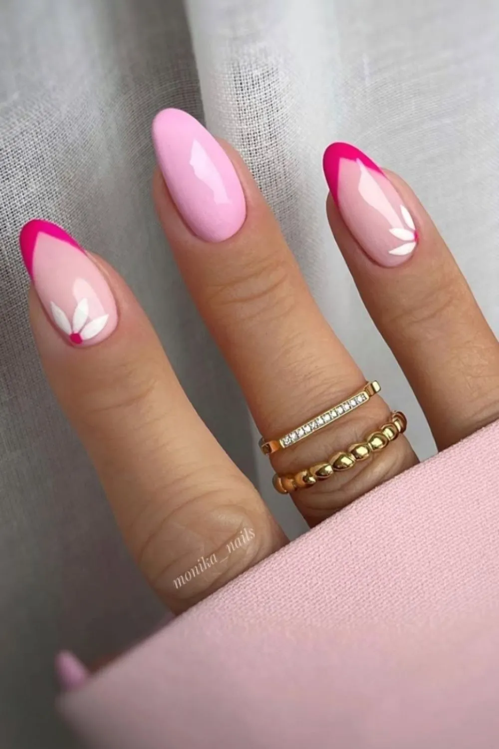 "Bright Pink Nails with White Flower Accents - Bold Feminine Floral Nail Design"