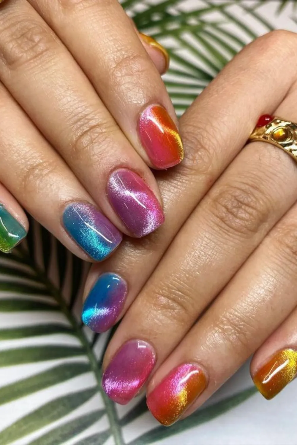 Rainbow Cat Eye Nails -Colorful rainbow cat eye nails with shifting shades and a mesmerizing magnetic line.