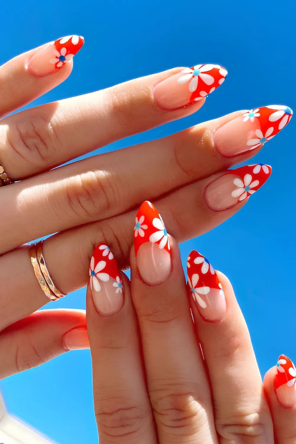 "Red French Tip with White Daisies - Bold & Fun Floral Nails"