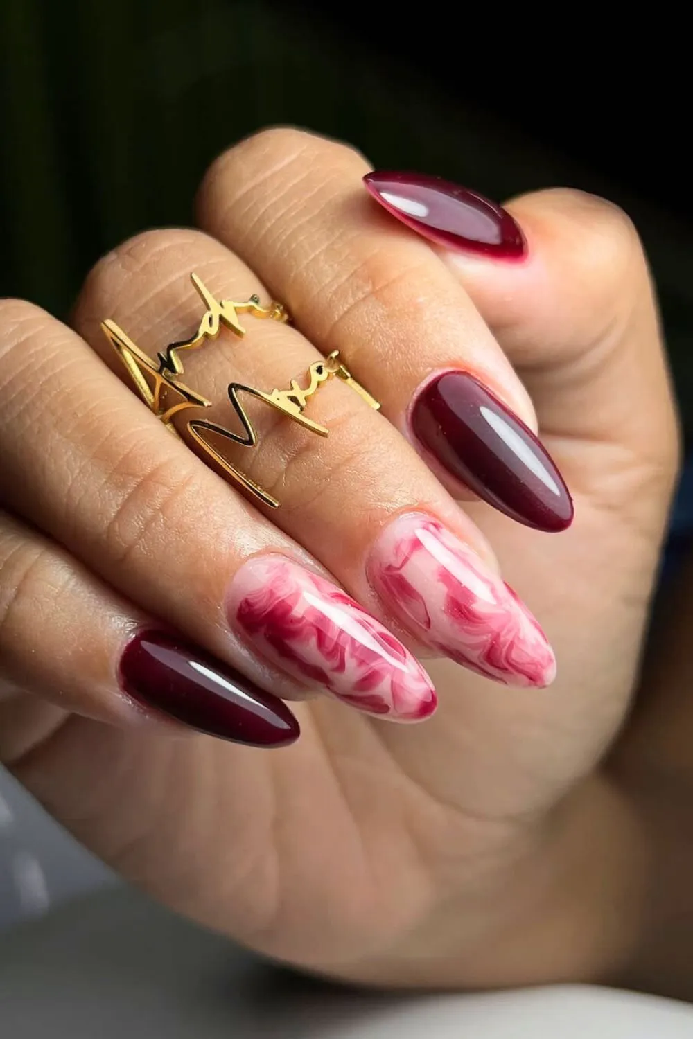 Red and Pink Marble Nail Art - Almond nails with a red base and marbled pink accent nails