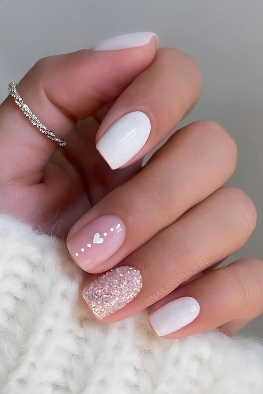 Romantic White Glitter Nails - Square nails in white with heart art and pink glitter accent nail.