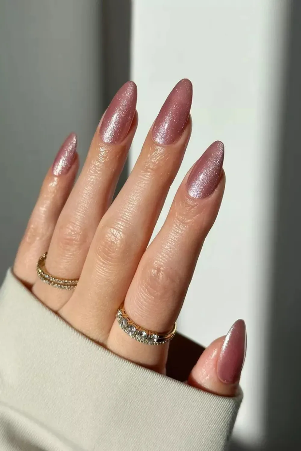 Rose Gold Cat Eye Nails-Elegant rose gold cat eye nails with a shimmering magnetic line, perfect for spring parties.