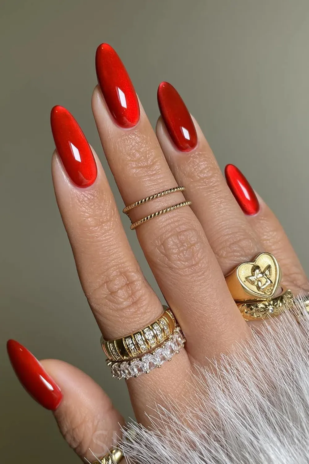 Ruby Red Cat Eye Nails- Intense red cat eye nails with a striking magnetic line, ideal for making a spring statement.