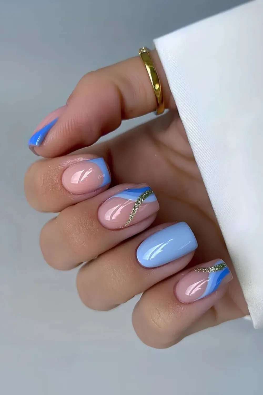 Sky Blue Nails with Silver Swirls - Artistic sky blue nails with silver swirl accents.