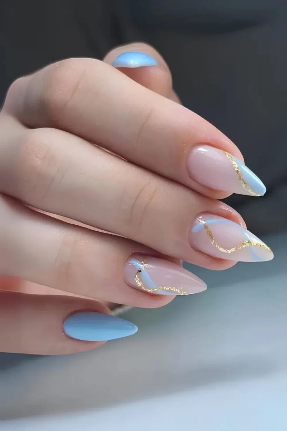 Sky Blue Nails with Gold Accents - Sky blue nails decorated with delicate gold art.