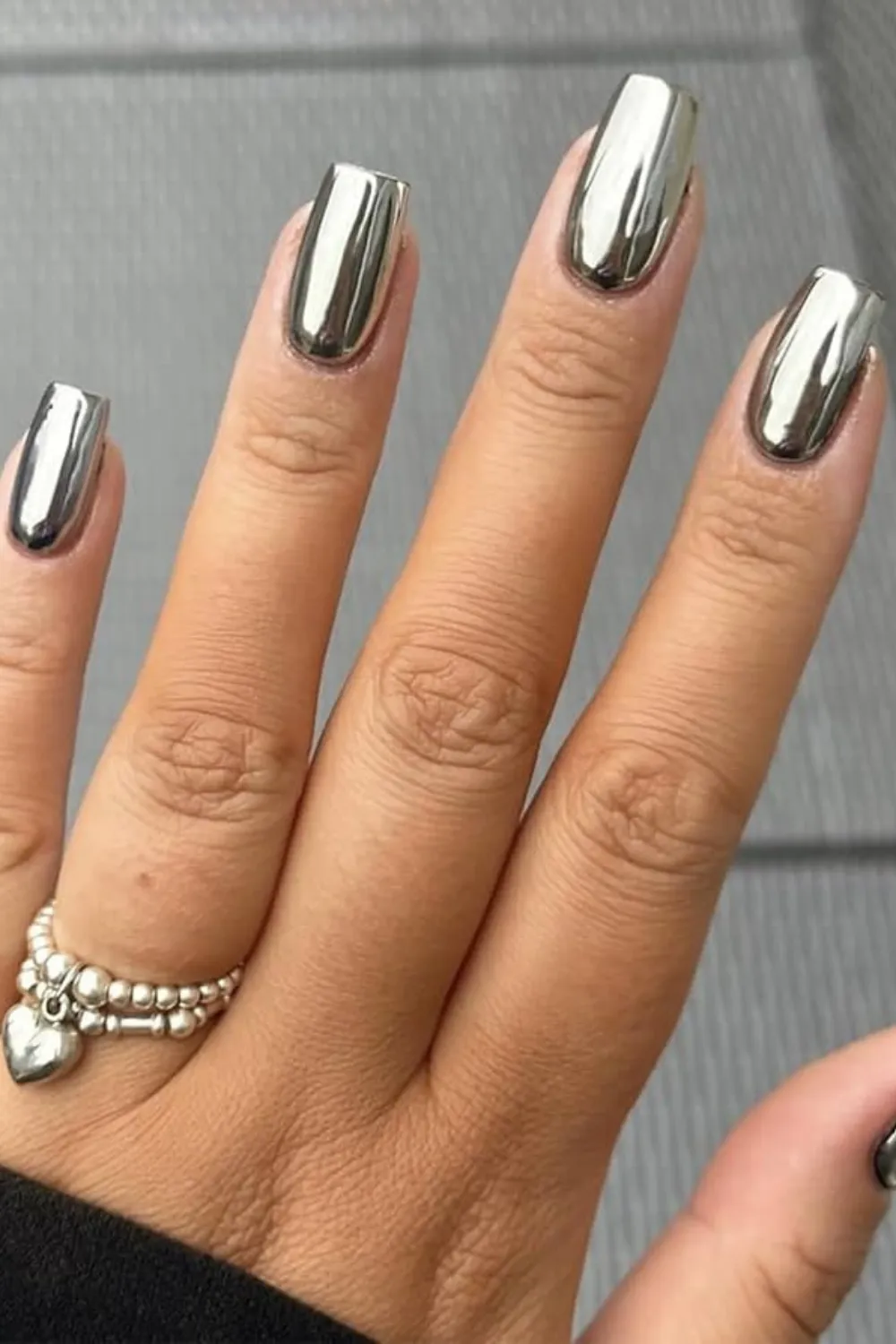 Chrome metallic silver nails
Sleek silver chrome manicure for a futuristic look