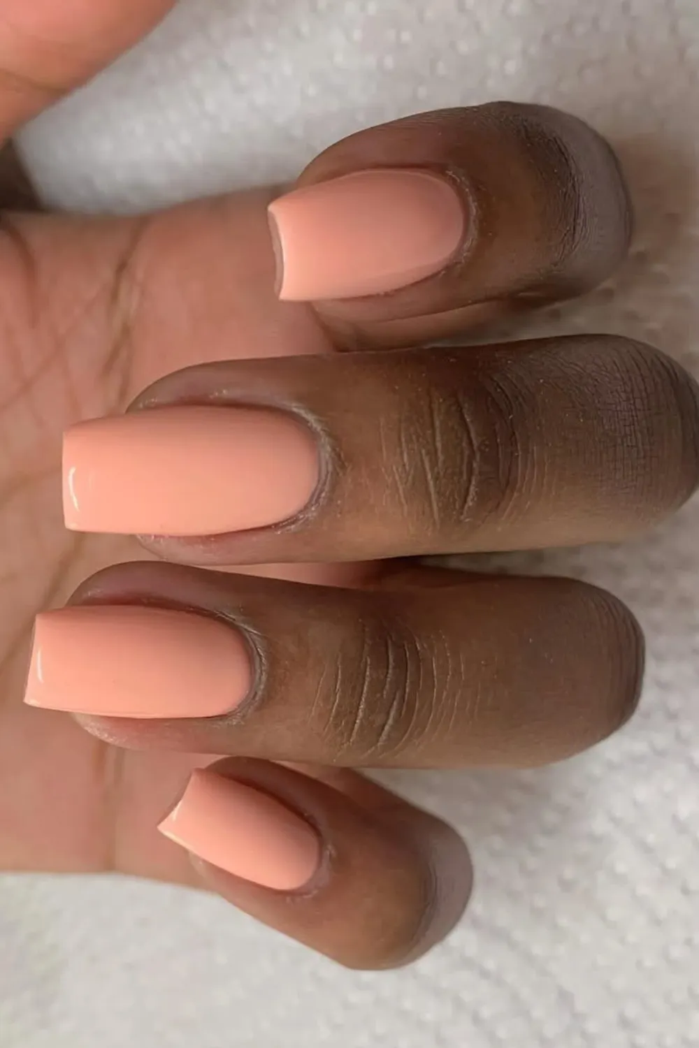 Soft Peach Manicure - Warm pastel peach nails for a delicate spring vibe.