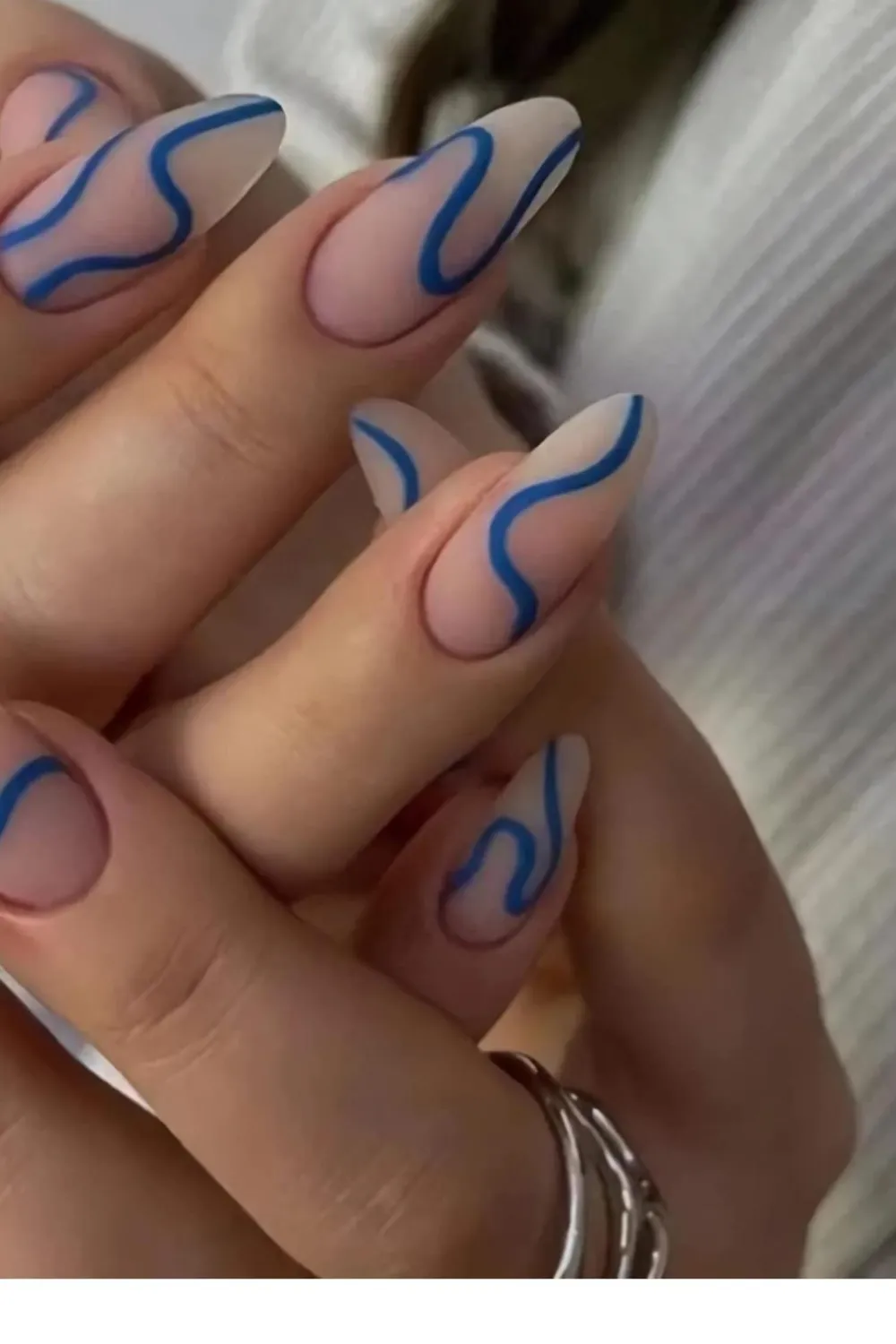 Swirly Design Almond Nails 2025 - Almond nails featuring playful swirl designs 2025