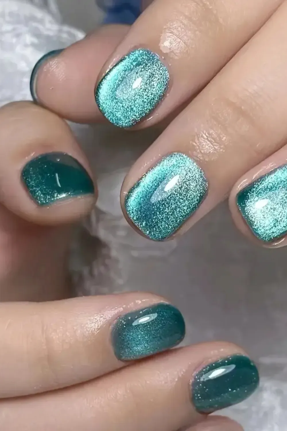 Teal Fantasy Cat Eye Nails - Shimmering teal cat eye nails with a dynamic magnetic effect, capturing the essence of spring.