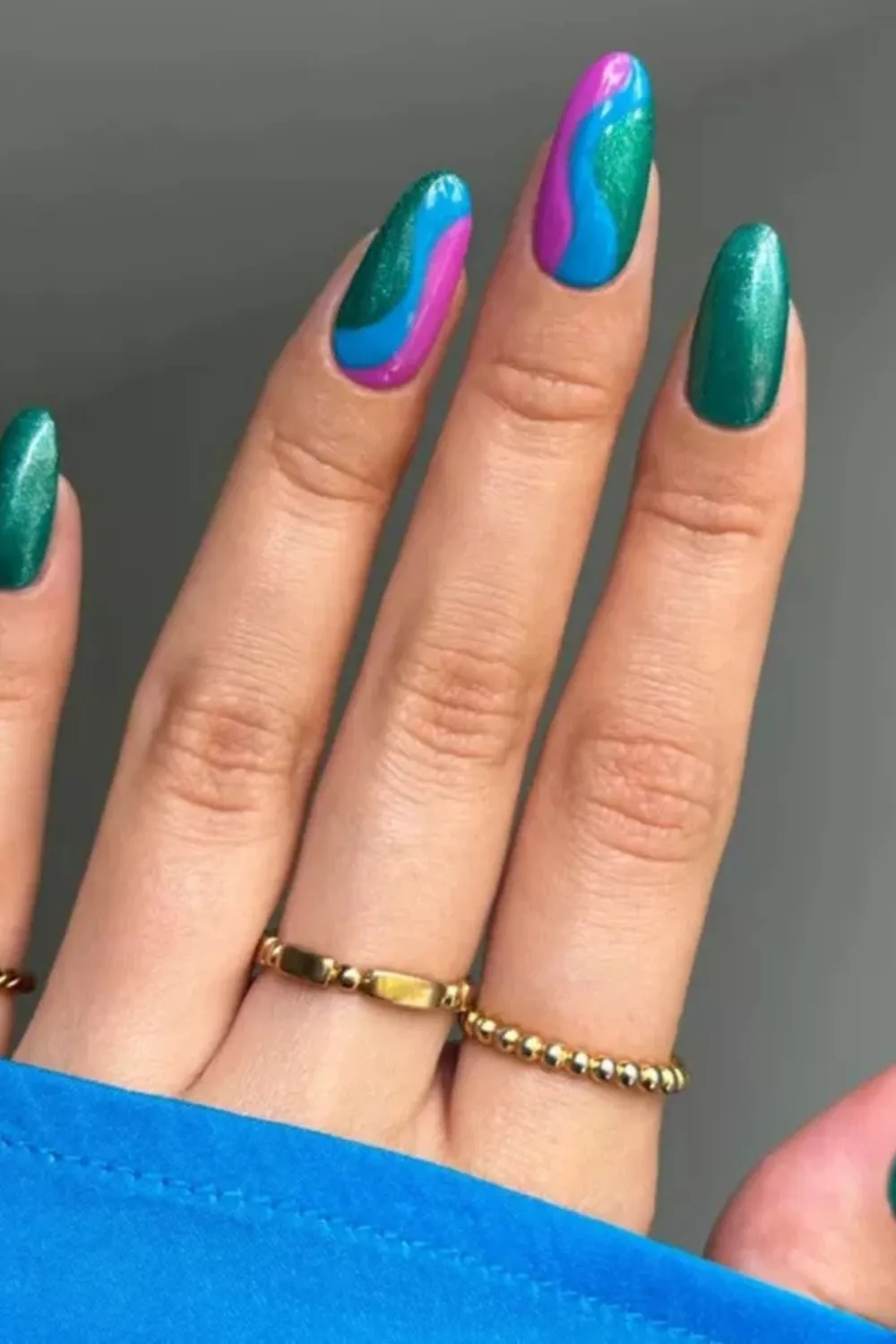 Wavy Multicolor Emerald Nail Art - Metallic green nails with colorful abstract wave designs