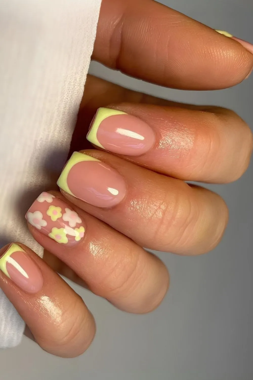 "Pastel Flower Accent Nails with Yellow French Tips - Fresh Floral Look"