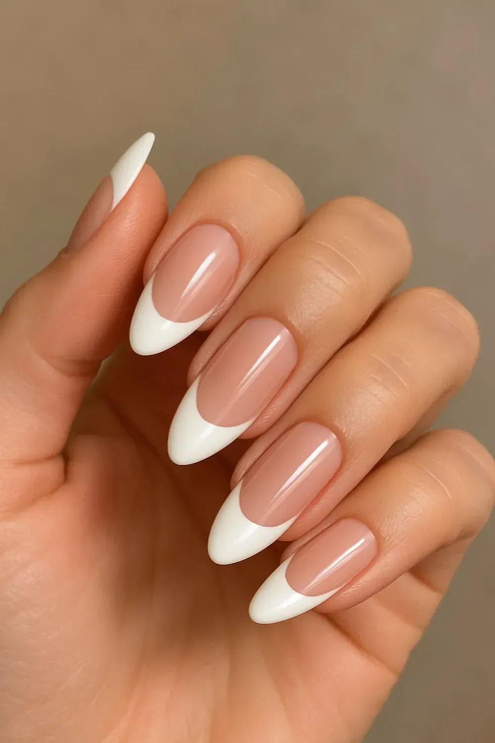 Sharp and sleek French tips with a deeper contrast, creating a striking modernized version of the classic 90’s French manicure