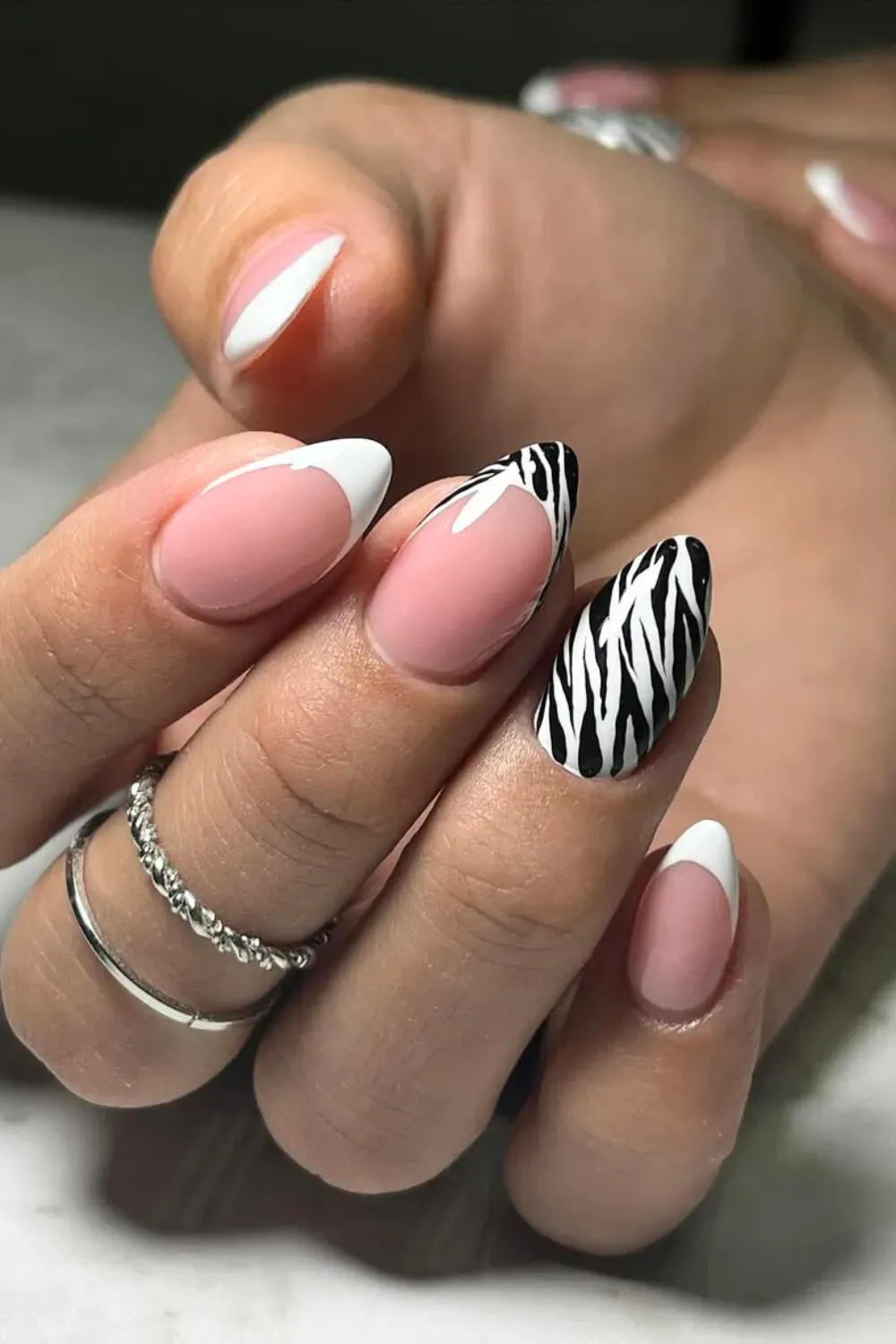 French tips with black and white contrasting zebra print accents