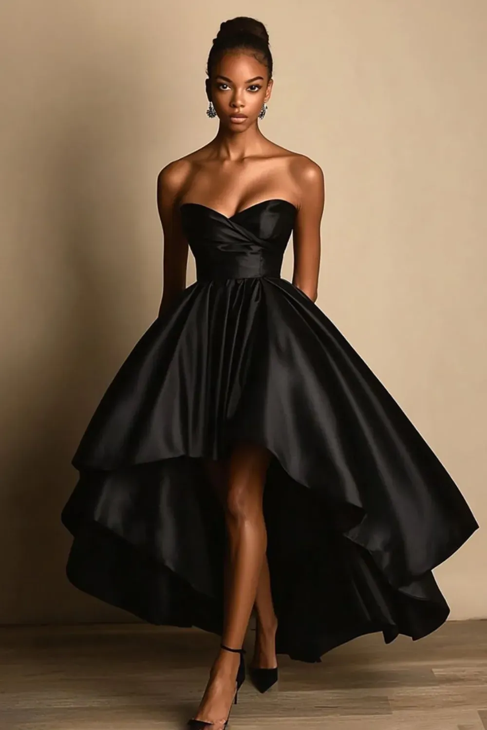 A playful black dress with a structured bodice and flared skirt, featuring a large bow at the front and stylish heels
