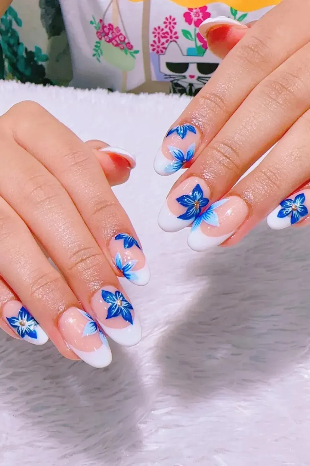 Blue Floral French Tips with Soft White Base - Refreshing blue floral French tips with soft white accents for a summery look