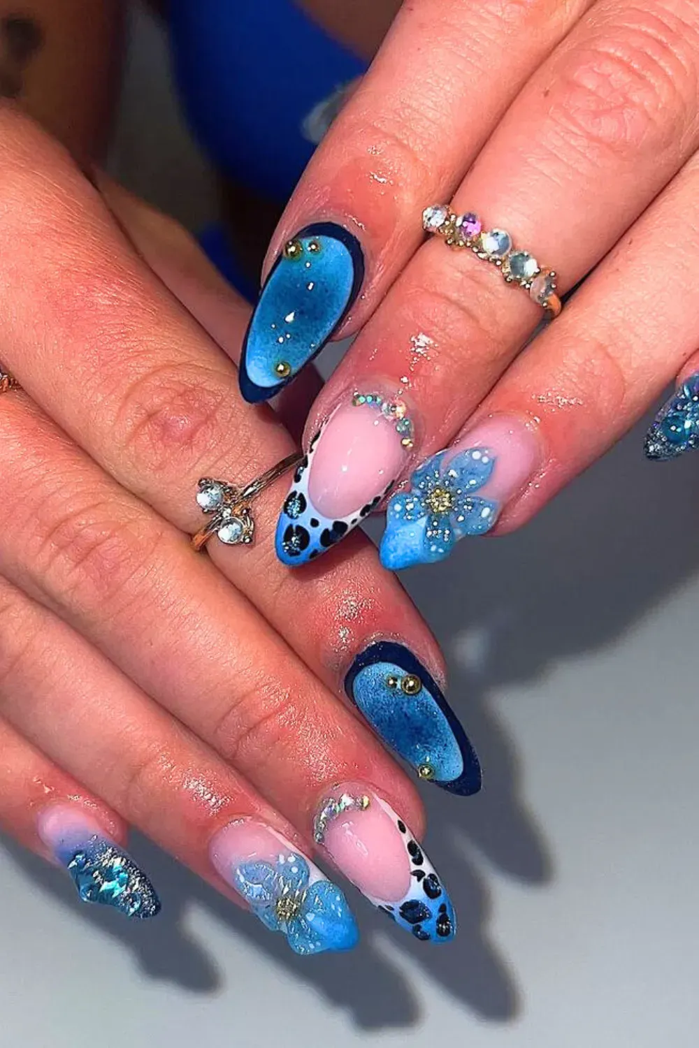 Blue Floral Nail Art with Gems - Beautiful blue floral nail art with tiny gems at the center of each flower