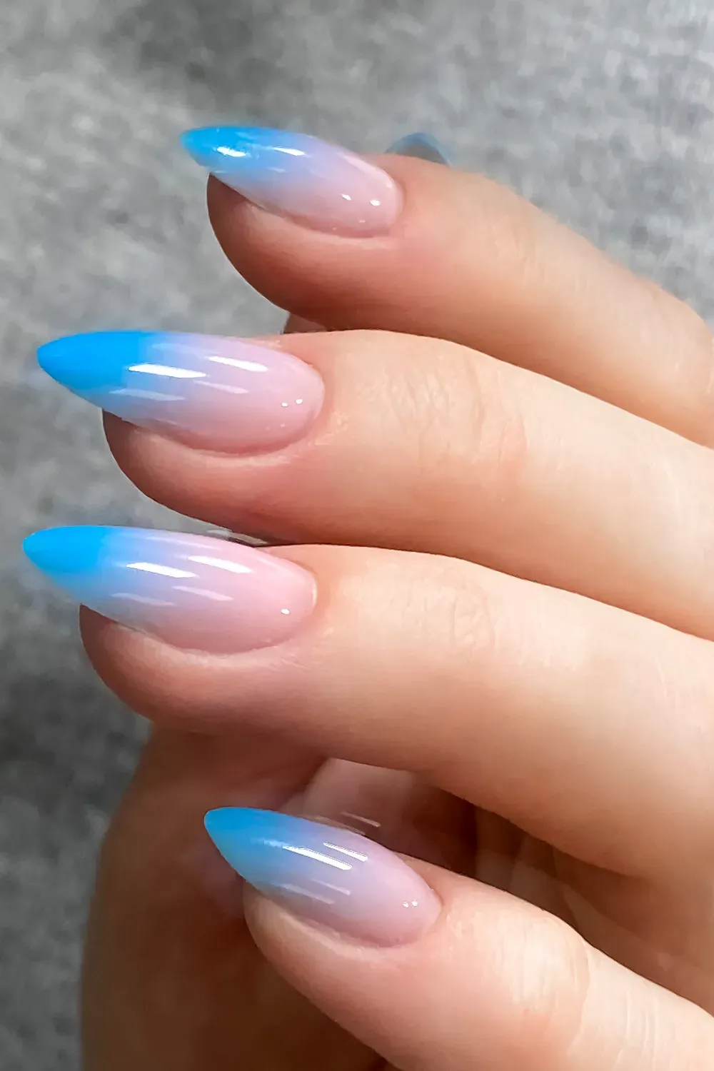 Blue Ombre French Tips – Gradient blue to nude French tips for a fresh look