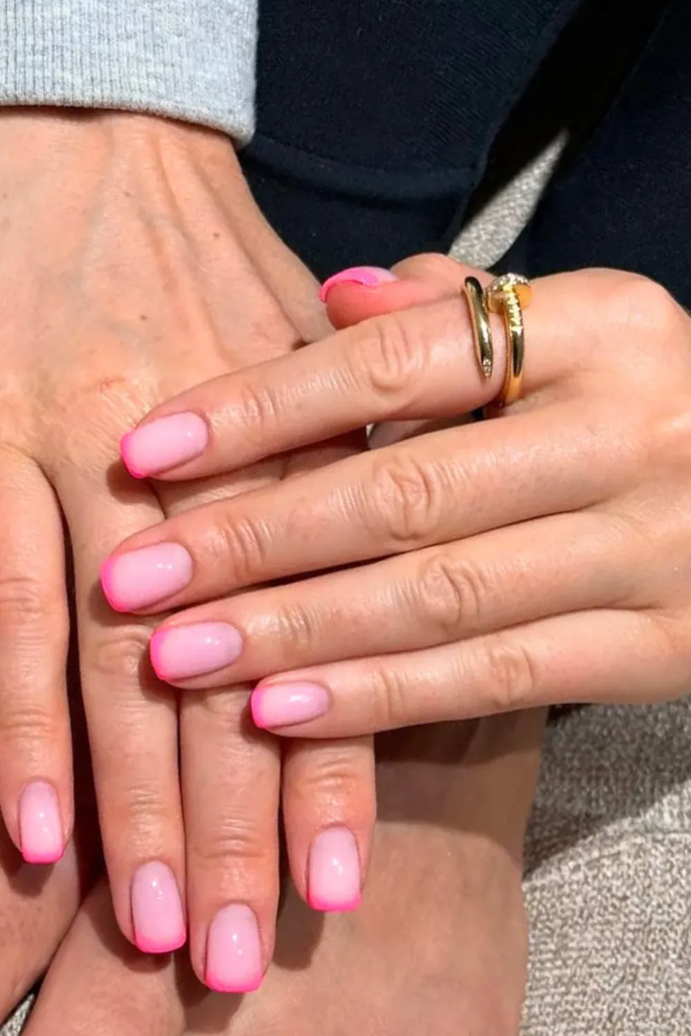 Vibrant neon pink French tips paired with matching neon pink toenails for a bold back-to-school style.
