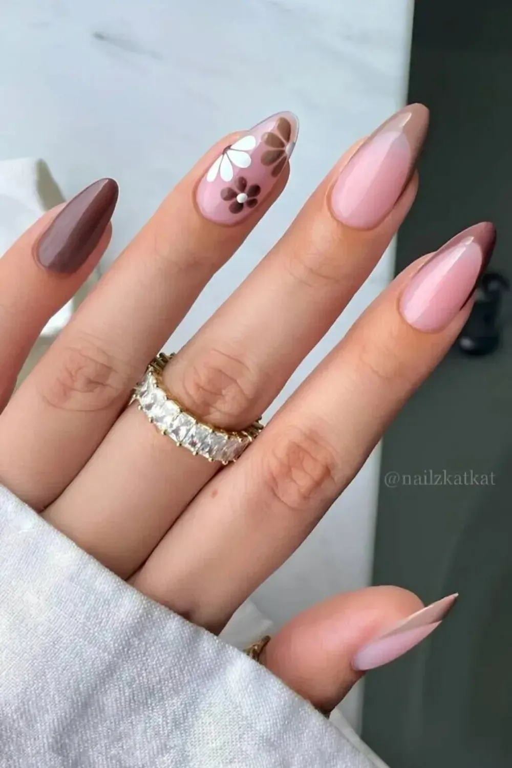Brown nails with tiny white daisy flower designs