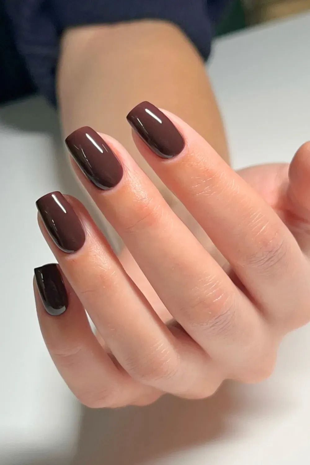 Rich, deep burgundy nails offering a bold, sophisticated look with a glossy finish
